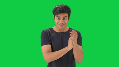 happy indian man clapping and appreciating green screen