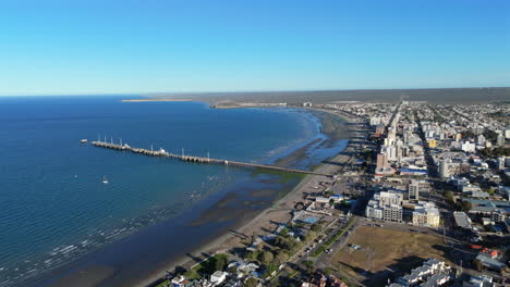 puerto madryn beach with muelle comandante luis piedra buena pier, aerial view
