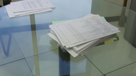 Office Documents on a Glass Table