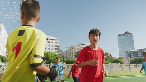 soccer kids playing in a sunny day