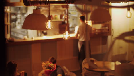 Cafe-view-with-visitors-and-waiter