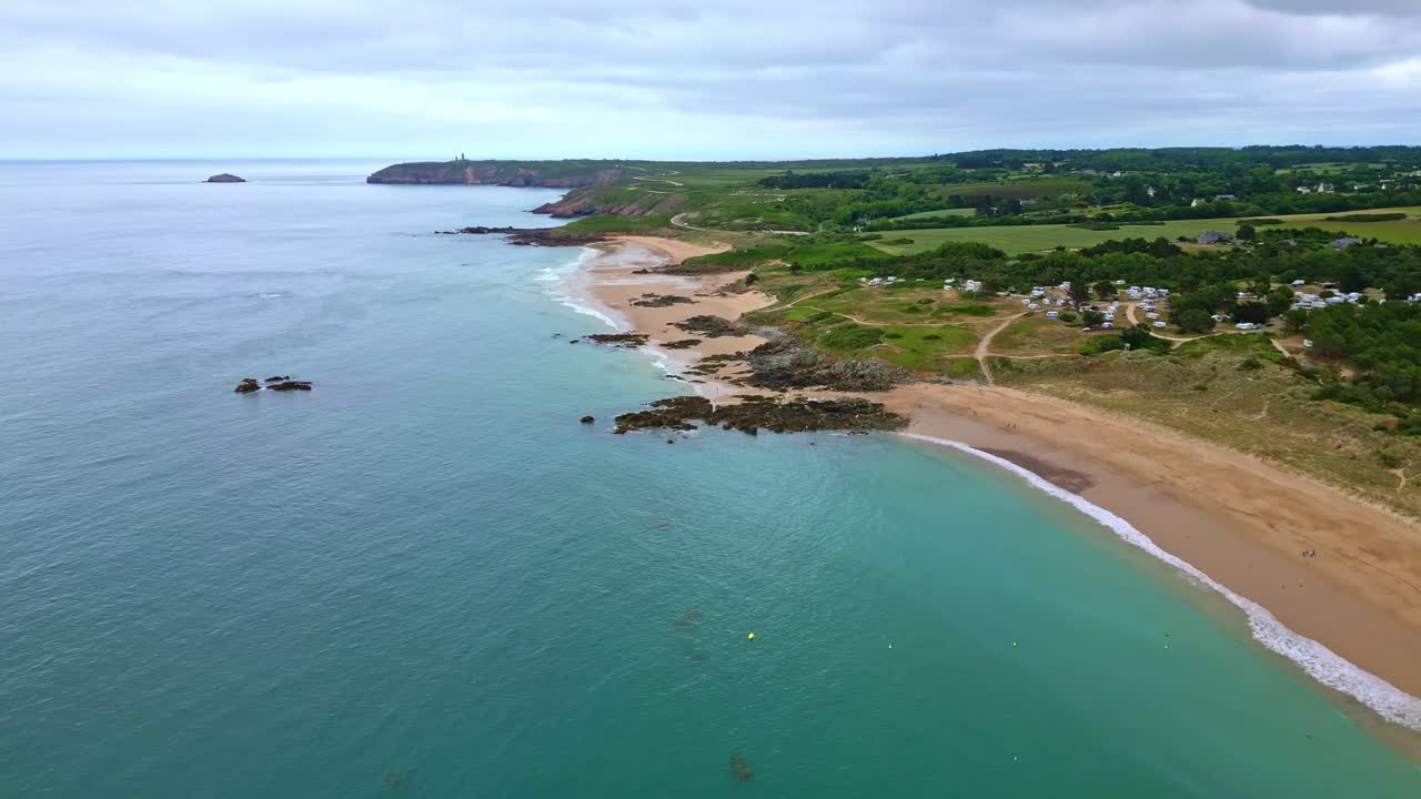 Amazing upward panoramic drone movement the Anse du Croc Beaches and Fosse Beach with distanced Cap Fréhel peninsula, Côtes-d'Armor, Brittany, France.