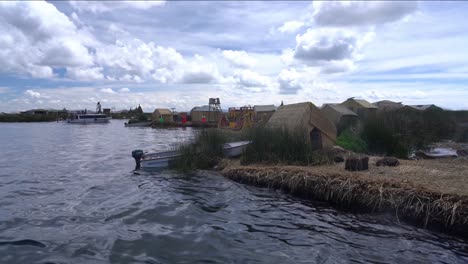 unstable handheld panorama of fishing village along water channel