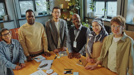 Group Portrait of Happy Immigrant Students and Teacher in Language School