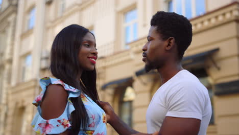 Loving-afro-couple-hugging-on-street.-Girl-and-guy-touching-each-other-outdoors