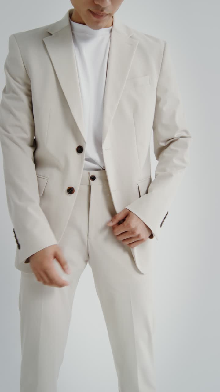 Man in Beige Suit and White T-Shirt