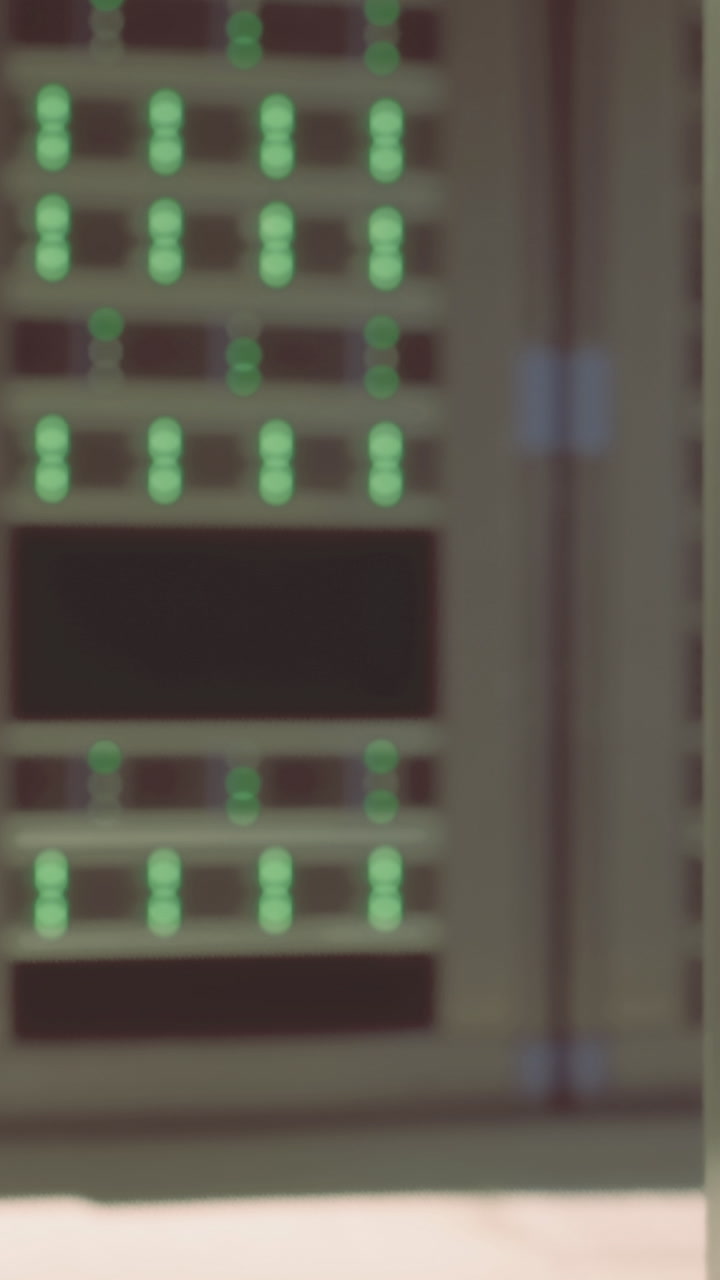Data center with server racks and lights indicating activity at night