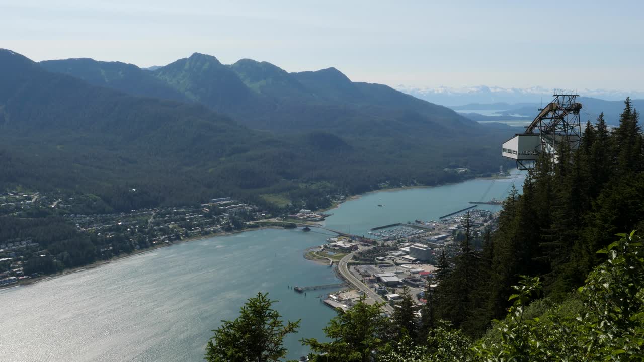 Juneau, Alaska.View from Mount Roberts over the city of Juneau and Gastineau channel with Douglas Bridge. Goldbelt Tram Skybridge on the right side