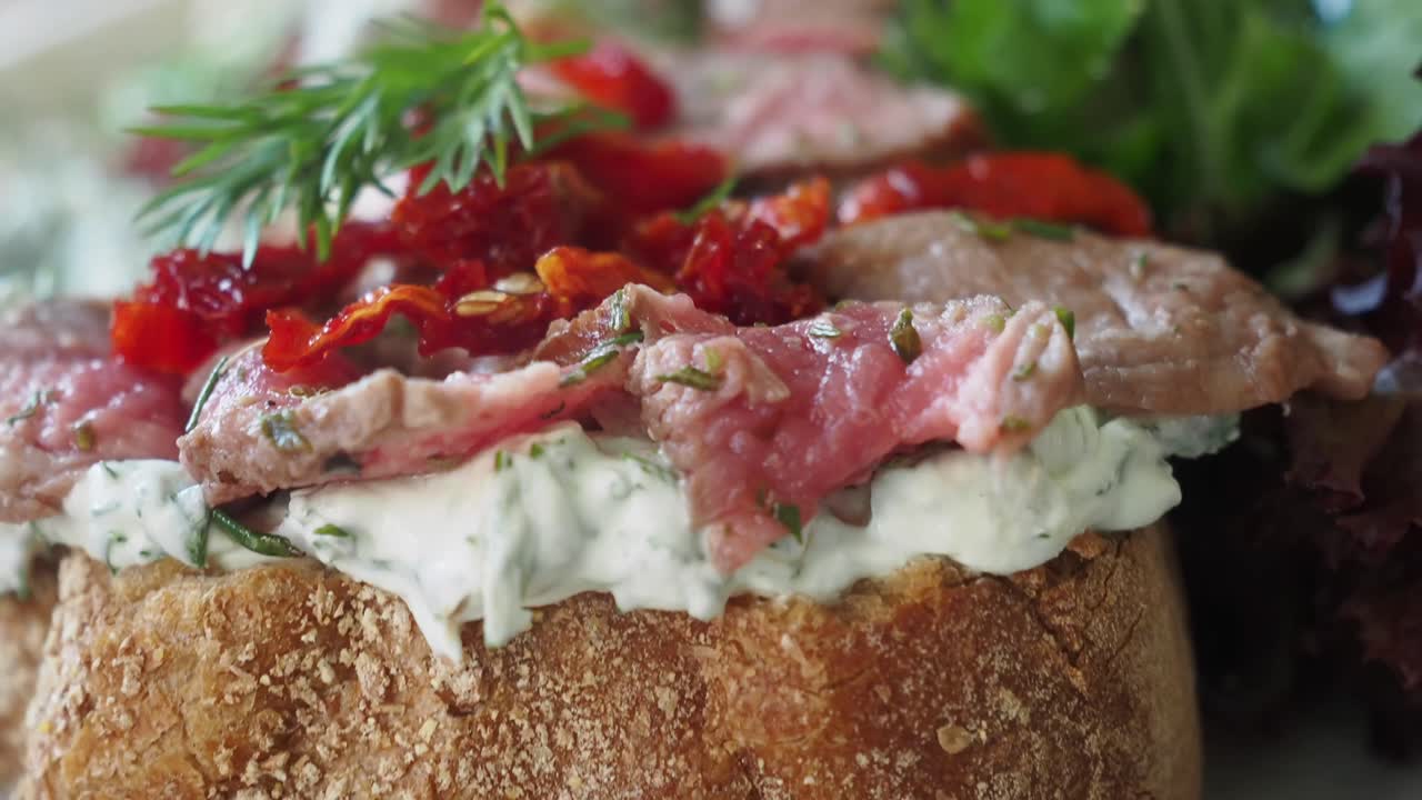 Close-up of carpaccio with tomatoes and greens