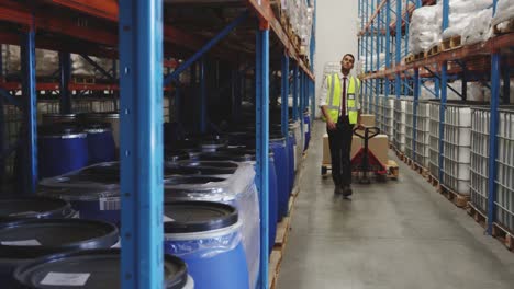 man moving boxes in a warehouse 4k