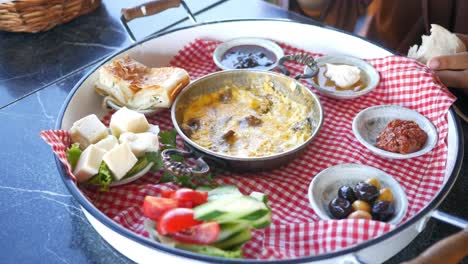 delicious turkish breakfast with eggs, cheese, olives, tomatoes and cucumbers