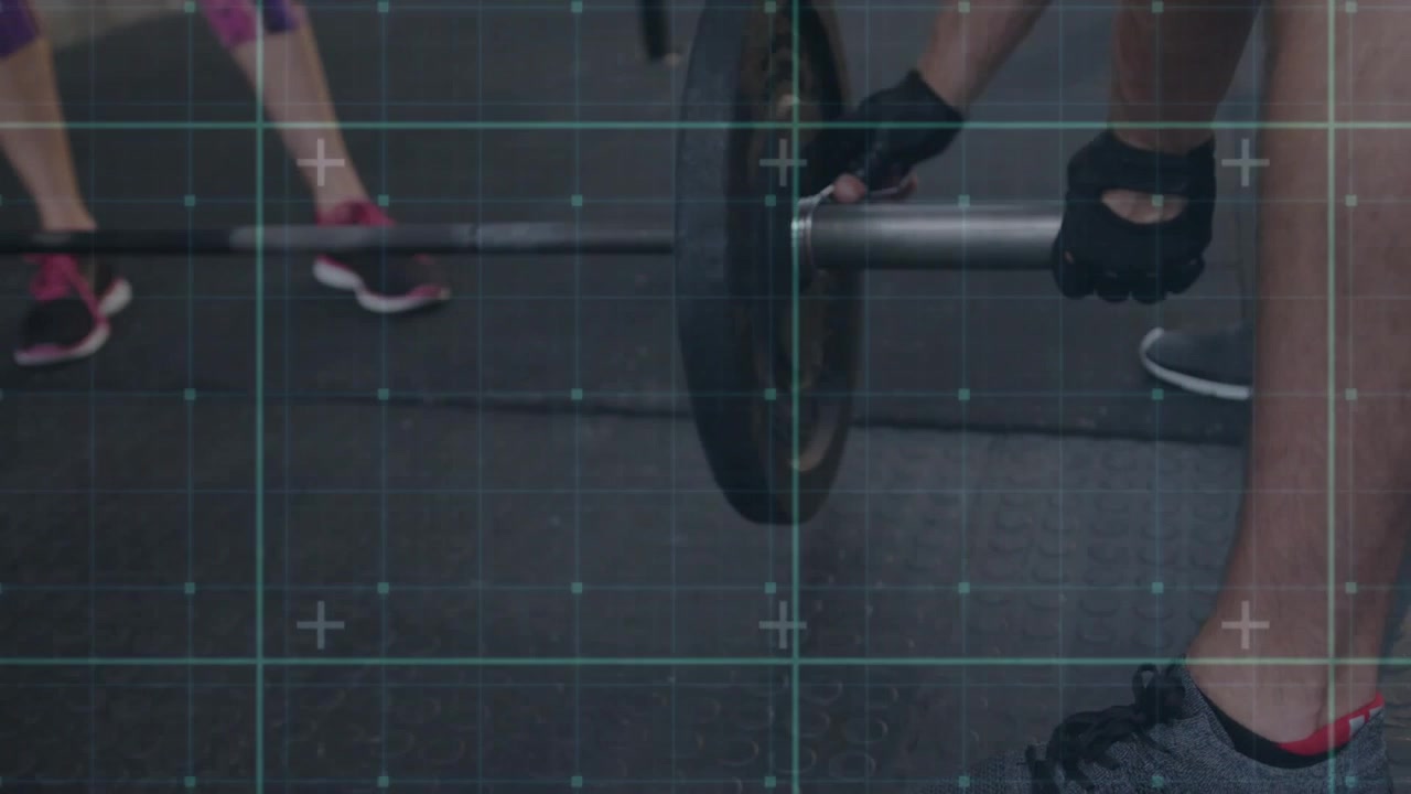 Male lifter approaching barbell in gym, gripping sleeve and securing collar, teal grid tracking