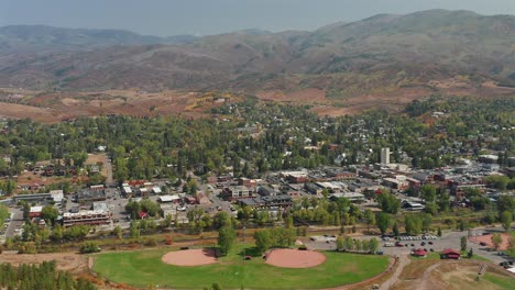 aerial view of downtown steamboat springs, two baseball fields, and a mountain range