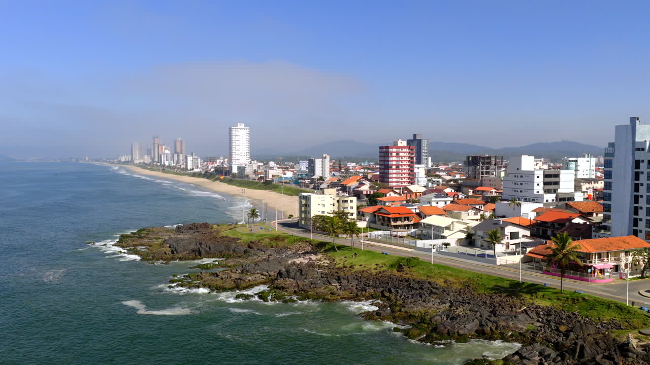 Aerial view of Barra Velha coastal town skyline with beachfront buildings along shoreline, Santa Catarina, Brazil