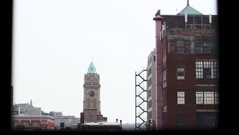 looking out window to downtown and church