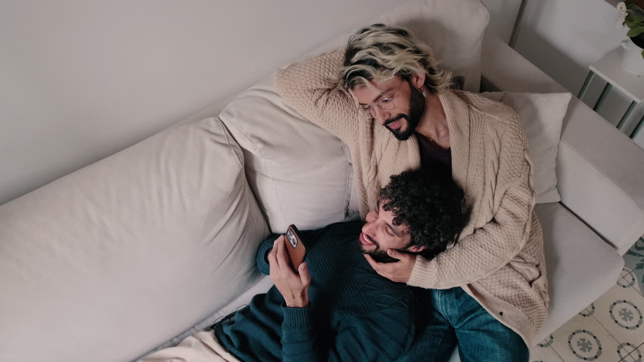 Gay Couple Relaxing at Home Together