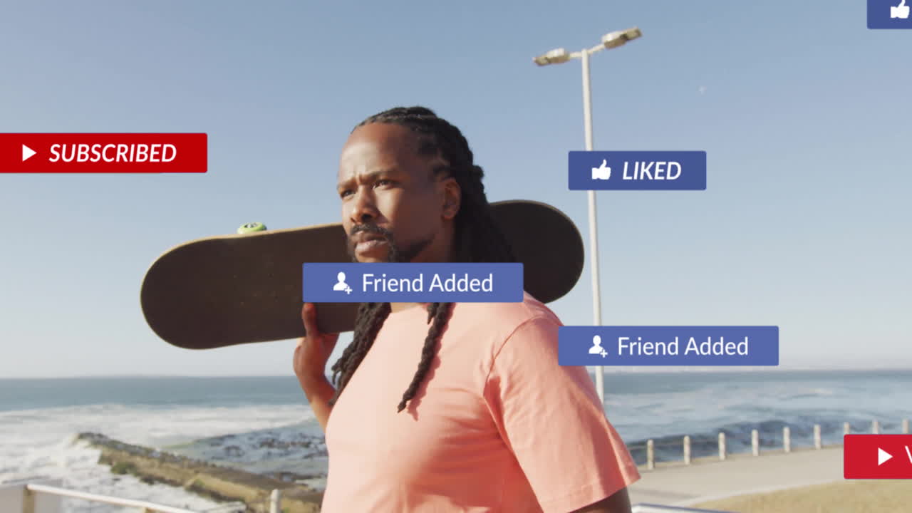 Male skateboarder holding skateboard on seaside promenade, showcasing social media marketing badges
