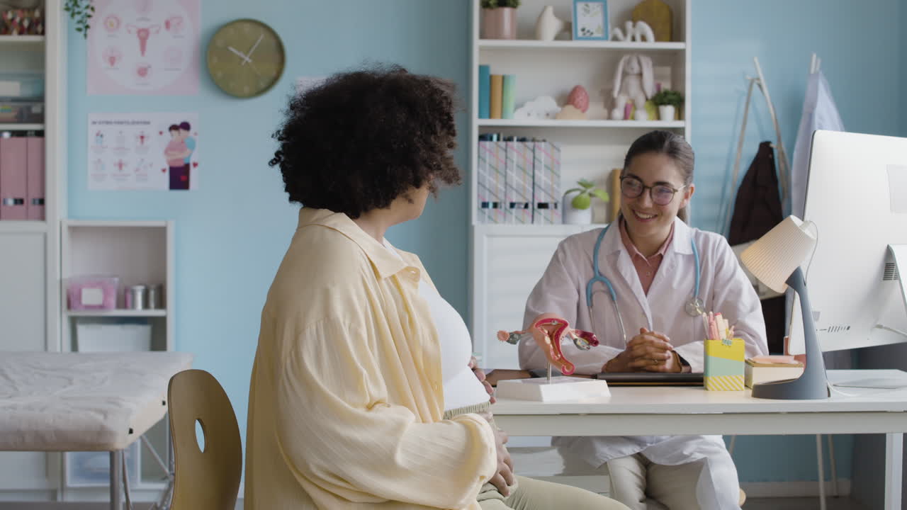 Pregnant woman visiting doctor for prenatal checkup