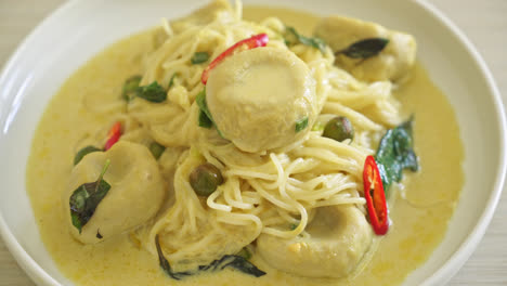 rice noodles with green curry and fish ball - thai food style