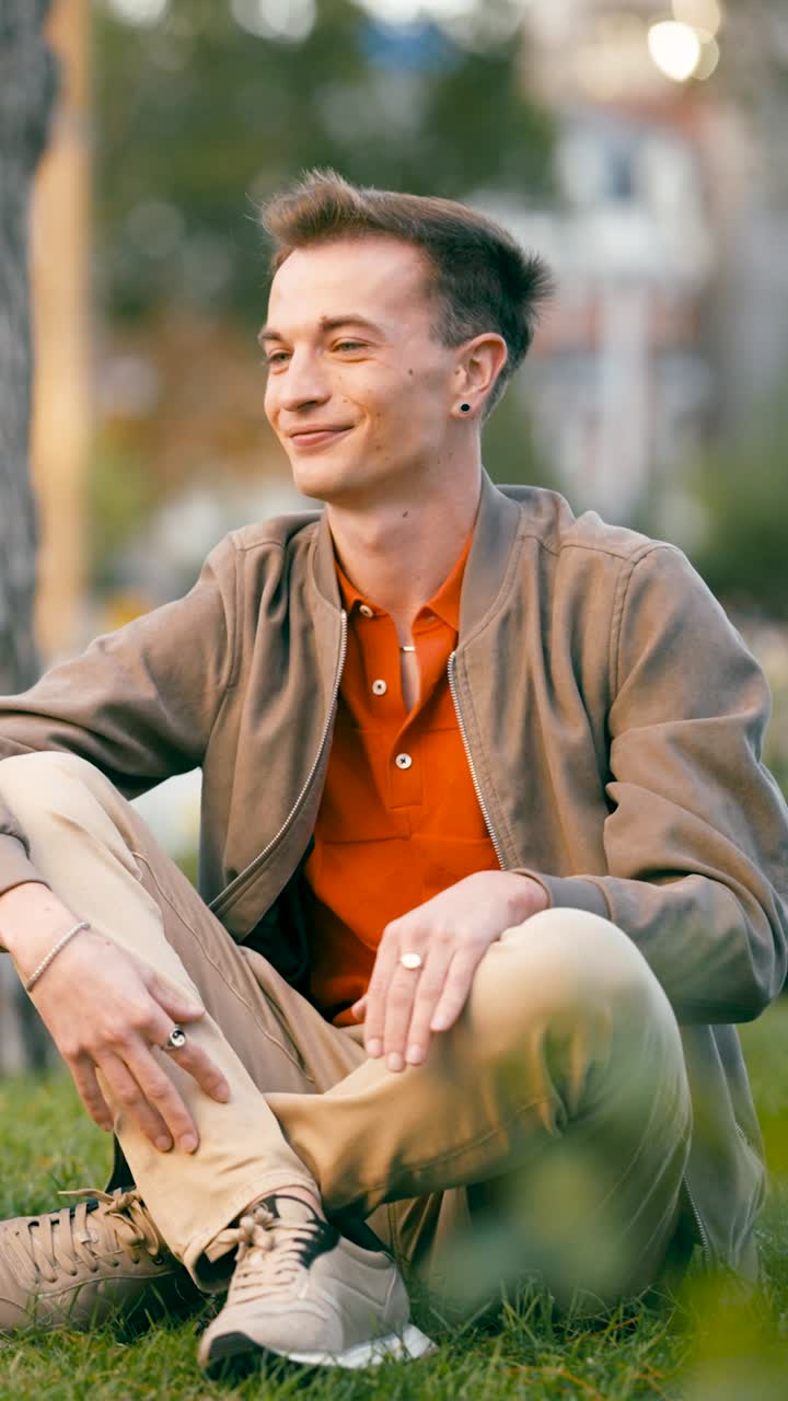 Man sitting in grass smiling