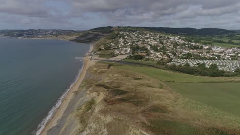 dorset coast aerial looking west over charmouth in the foreground and lyme regis in the distance