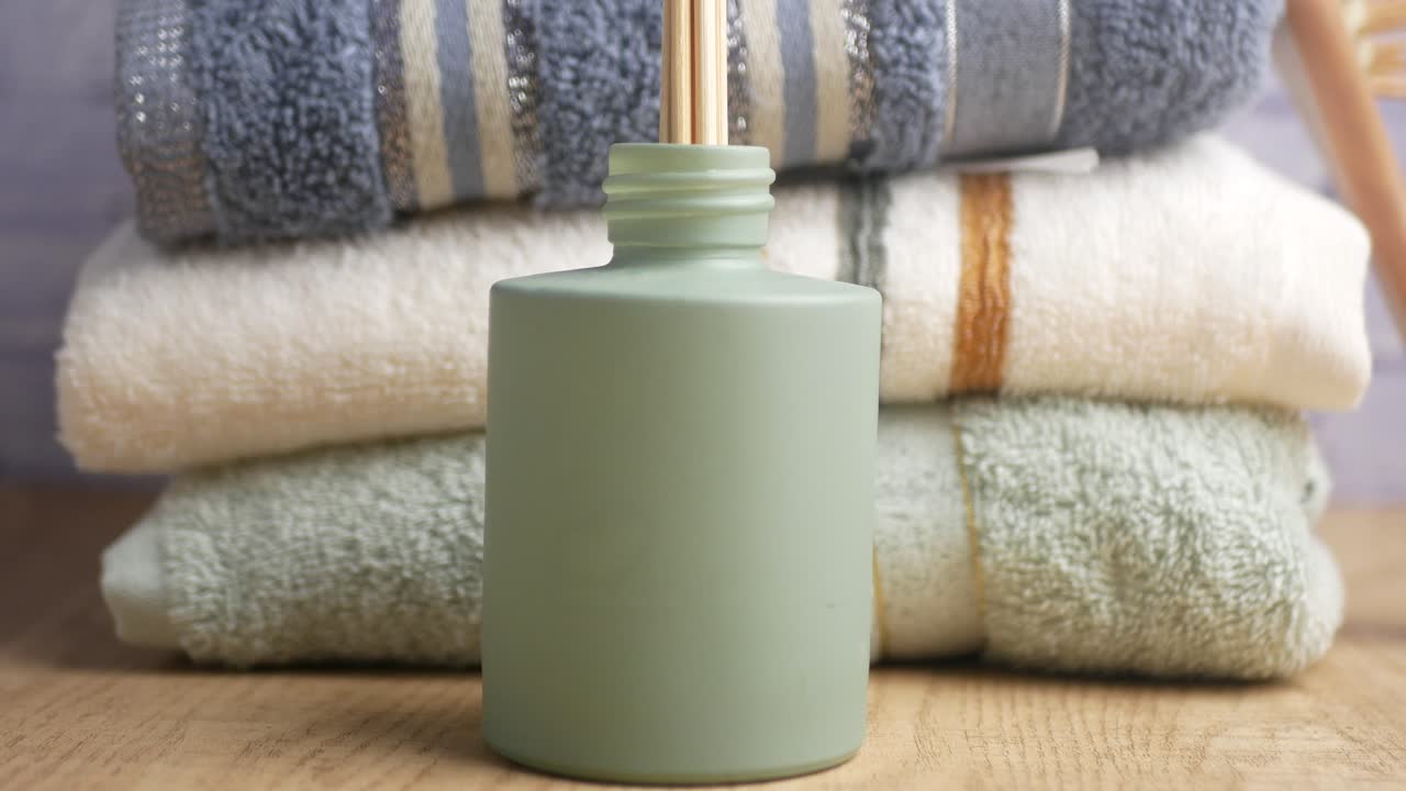 Stack of Towels and Diffuser