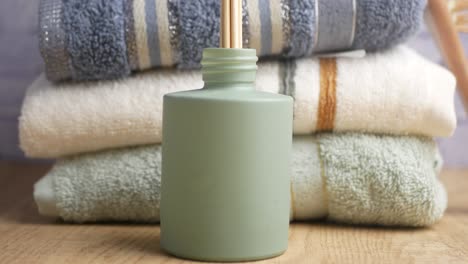stack of towels and diffuser