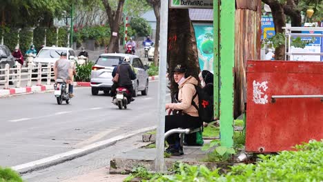 motorbikes and cars on a bustling street