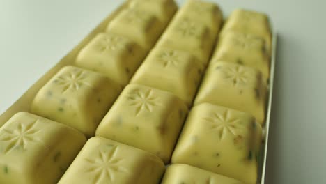 close-up of a box of gourmet white chocolate squares