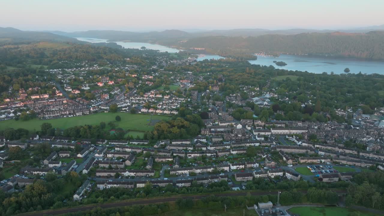 Lakeside rural town from above at sunrise. Summer. Windermere, Cumbria, UK