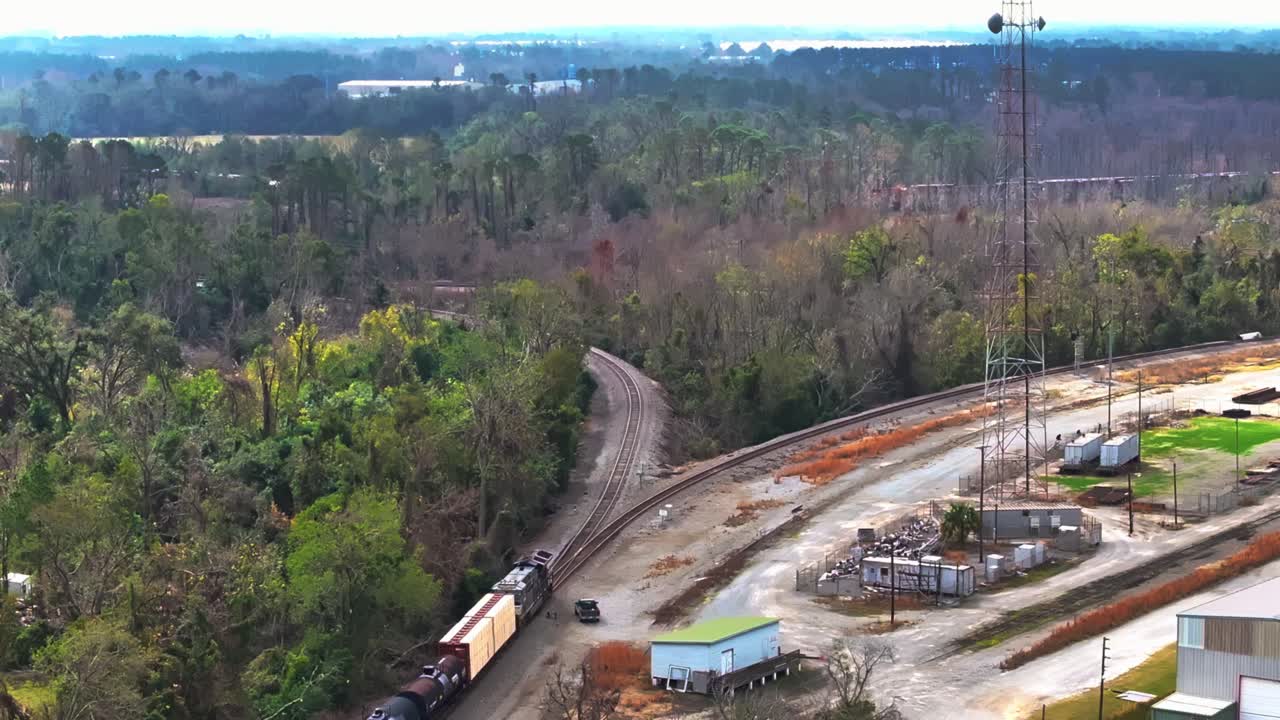 Above View Of Trains Traveling On The Railway Near Valdosta In Georgia. Aerial Drone Shot