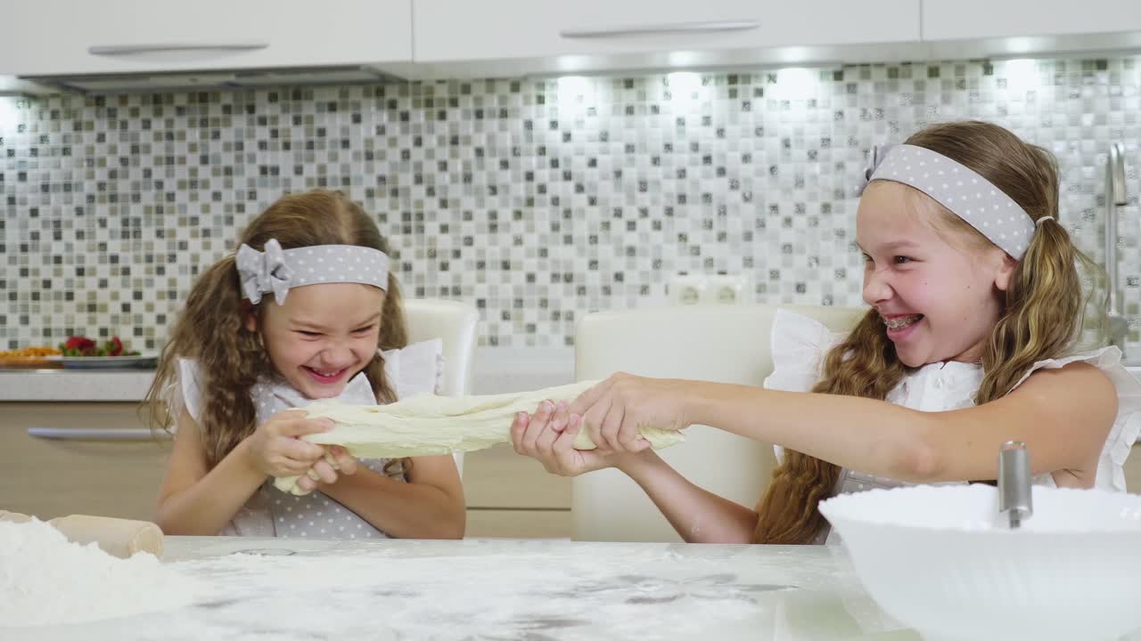 Twin Girls Having Fun Baking