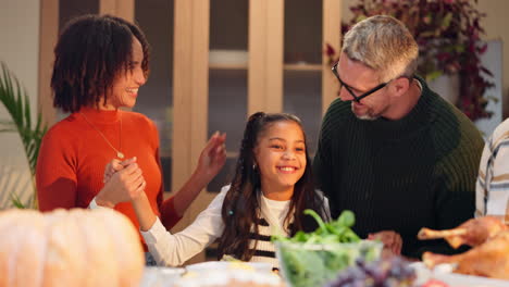 a family enjoying thanksgiving dinner