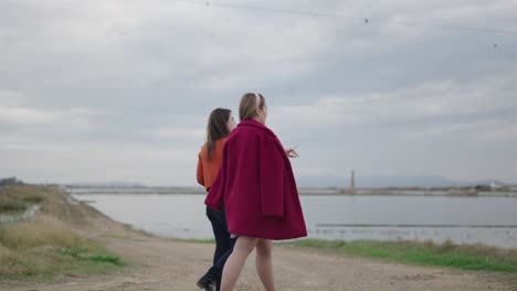 friends exploring a lakeside path