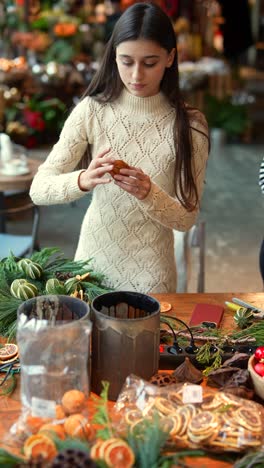 woman crafting christmas wreaths