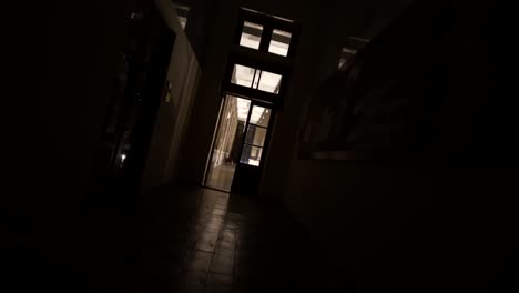 slow cinematic rotating shot entering a bright hallway from outside