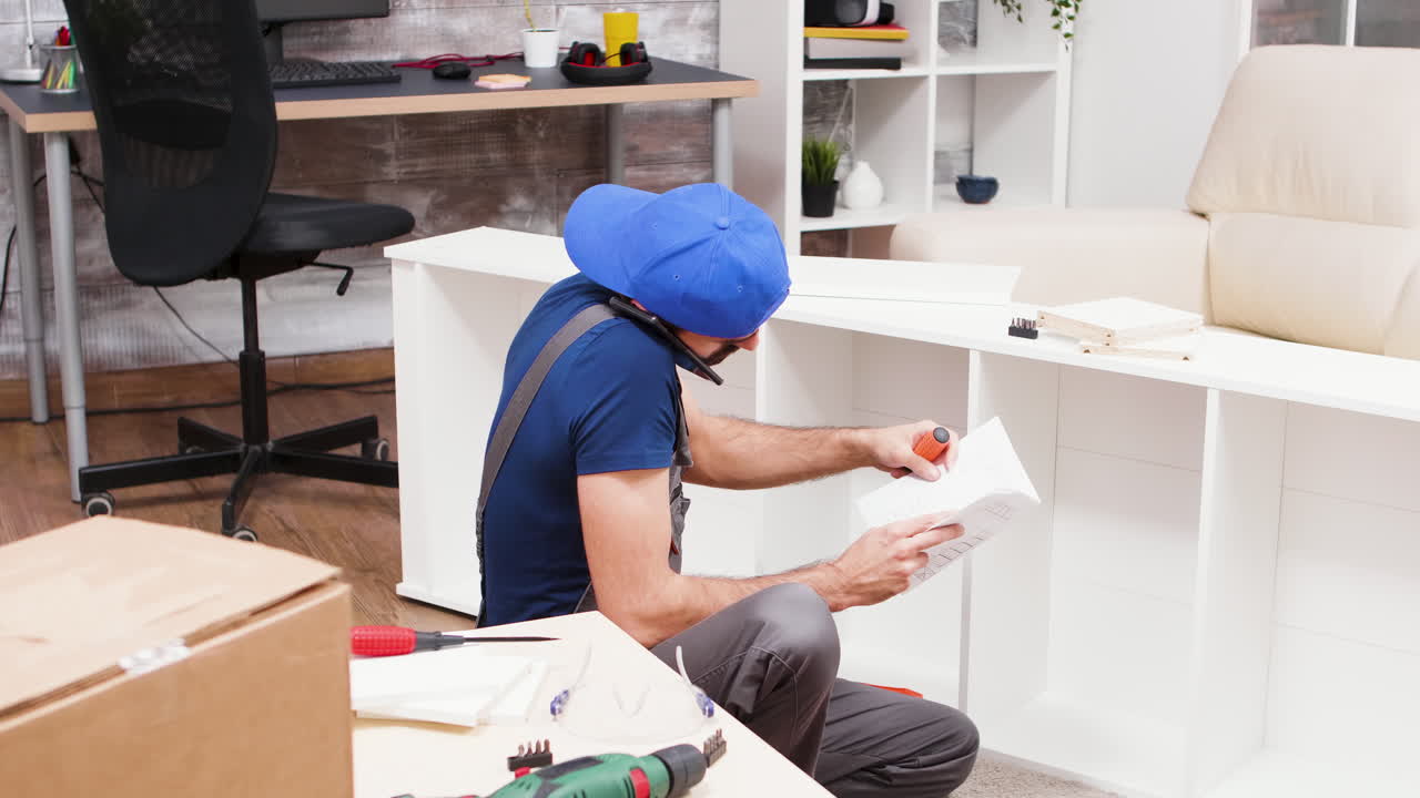 Man assembling furniture at home