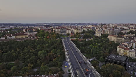 Prague-Czechia-Aerial-v124-low-flyover-Nusle-bridge-and-Park-Folimanka-capturing-vehicle-traffics-on-the-road-and-cityscape-of-Vinohrady-neighborhood-at-dusk--Shot-with-Mavic-3-Cine---November-2022