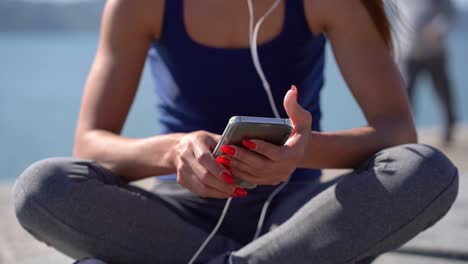 cropped shot of girl using smartphone outdoor