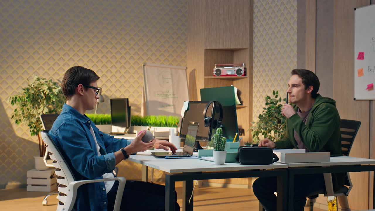 Busy businessmen working modern office. Man playing colleague staring computer