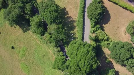 Aerial-footage-of-beautiful-green-countryside-fields-in-springtime