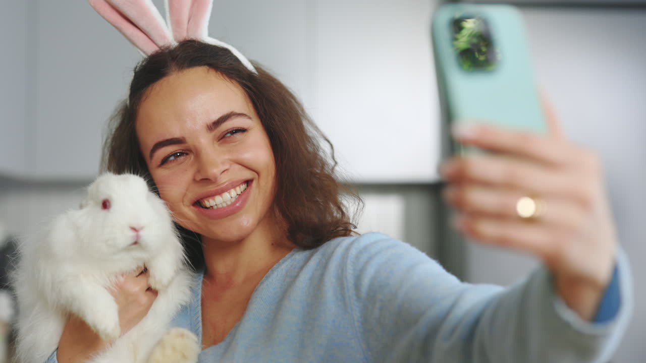 Woman taking a selfie with a bunny