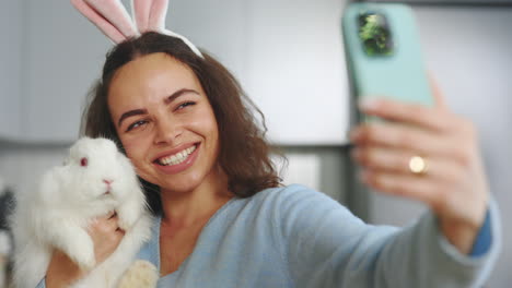 woman taking a selfie with a bunny