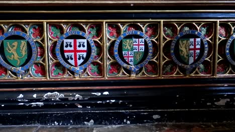 close up of inscription of some british royal heraldic shields in westminster abbey