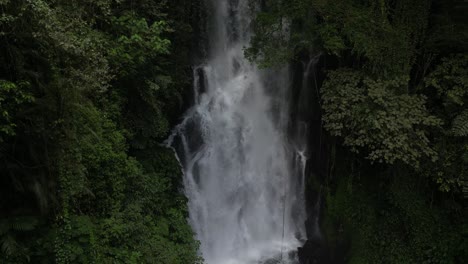 powerful waterfall close up in bali, indonesia. aerial