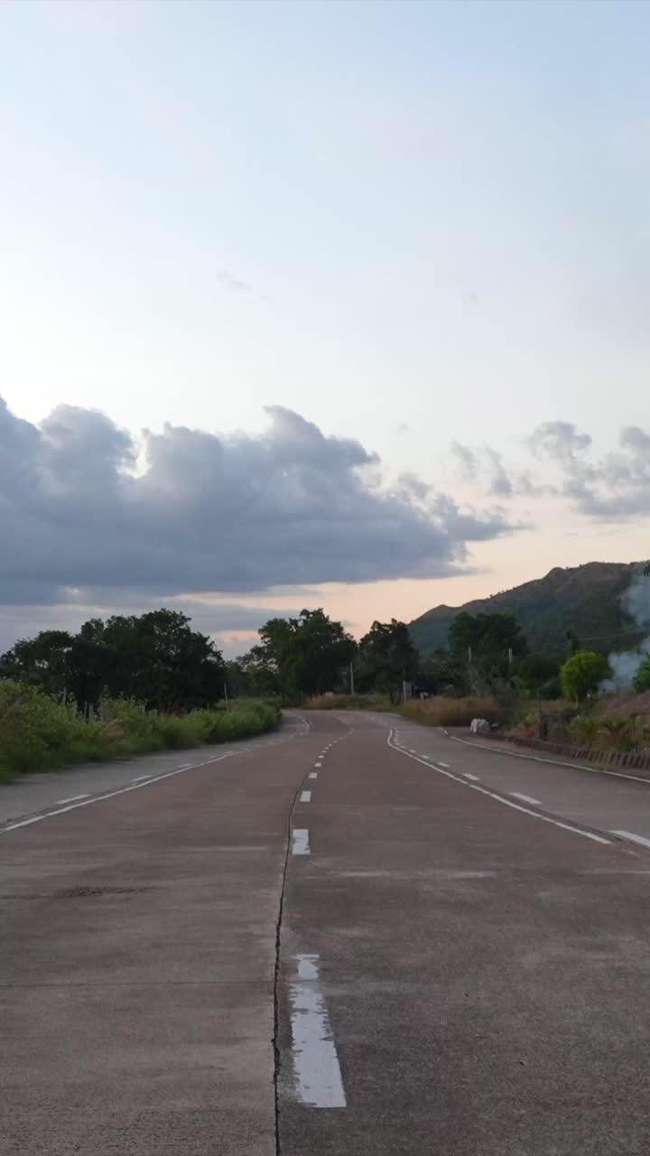 Woman in Orange Dress on Road