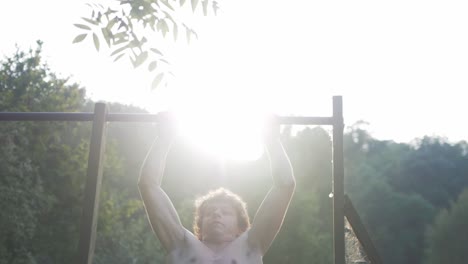 Young-man-does-explosive-clap-pull-up