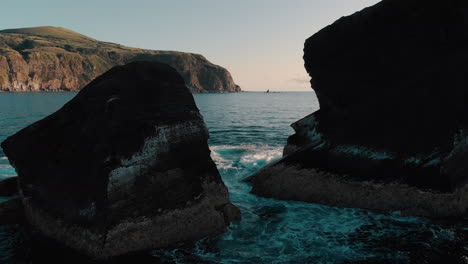 ocean view through rocky cliffs