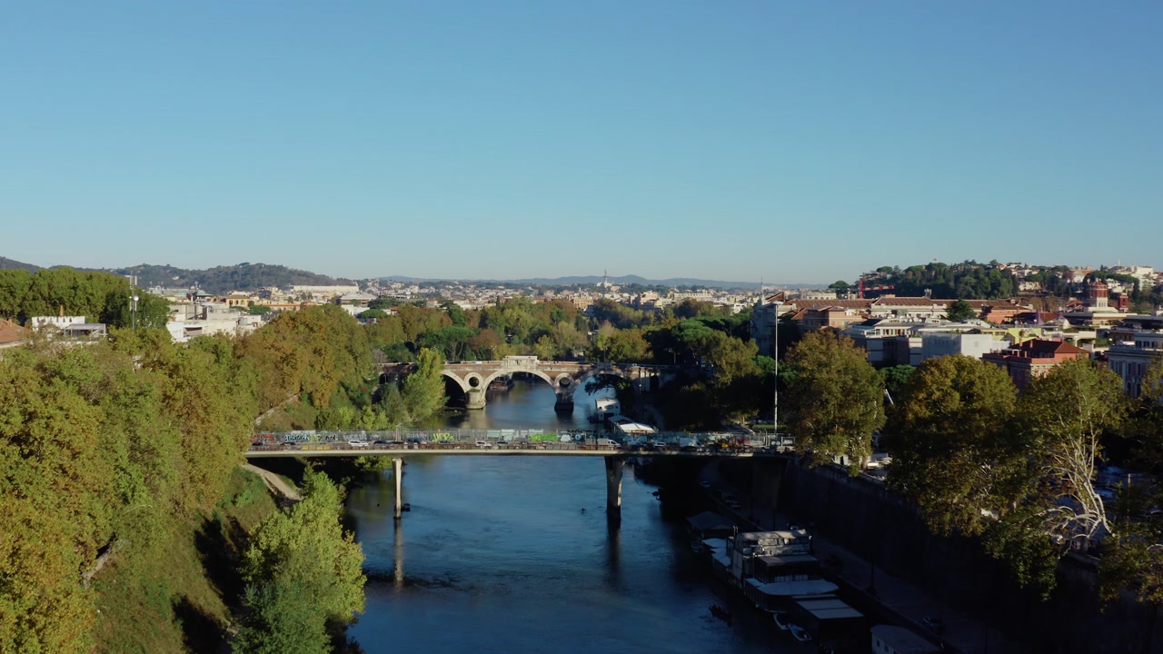 Aerial Drone View of Rome Historic Center with Tiber River Bridge, Urban Traffic, Autumn Trees and Panoramic Skyline of the Eternal City in Italy.