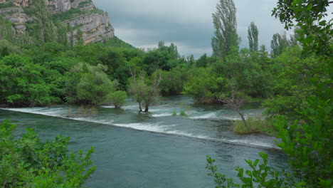 waterfall krka national park with plants growing out of the water